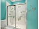 Bathroom with walk-in shower and mosaic tile details at 7676 Bergamo Ave, Sarasota, FL 34238