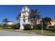 Community center with clock tower, landscaping, and building at 7676 Bergamo Ave, Sarasota, FL 34238