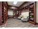 Community library with comfortable seating and a wide selection of books at 7676 Bergamo Ave, Sarasota, FL 34238