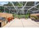 Screened patio with built in grill and kayaks at 7676 Bergamo Ave, Sarasota, FL 34238
