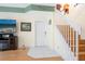 Interior view of entryway with staircase and hardwood flooring at 7676 Bergamo Ave, Sarasota, FL 34238