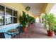Quaint walkway with lush landscaping and outdoor seating at 7676 Bergamo Ave, Sarasota, FL 34238