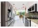 Modern kitchen with stainless steel appliances and granite countertops at 7676 Bergamo Ave, Sarasota, FL 34238