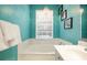 Bathroom with soaking tub and a chandelier at 7676 Bergamo Ave, Sarasota, FL 34238
