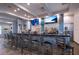 Community bar with seating and multiple TV screens at 7676 Bergamo Ave, Sarasota, FL 34238