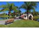 Scenic walking path with a charming bridge over a lake at 7676 Bergamo Ave, Sarasota, FL 34238