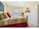 Bedroom with full bed, built in shelving and window coverings at 7676 Bergamo Ave, Sarasota, FL 34238
