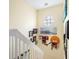 Upstairs hallway with framed photos and athletic medals at 7676 Bergamo Ave, Sarasota, FL 34238