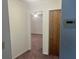 Hallway with carpet and access to bedrooms at 4210 66Th Street W Cir, Bradenton, FL 34209