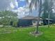 Condo with a screened porch and landscaped yard at 4210 66Th Street W Cir, Bradenton, FL 34209