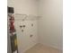 Laundry room with shelving, water heater, and fire extinguisher at 4210 66Th Street W Cir, Bradenton, FL 34209