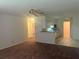 Spacious living room with carpet flooring and neutral walls at 4210 66Th Street W Cir, Bradenton, FL 34209