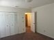 Bright bedroom featuring double door closets and plush carpeting at 4210 66Th Street W Cir, Bradenton, FL 34209