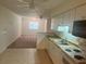 Kitchen features white cabinetry, a gas stove and a microwave at 4210 66Th Street W Cir, Bradenton, FL 34209