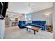 Open concept living room with sectional sofa and kitchen view at 17724 Gawthrop Dr # 201, Bradenton, FL 34211