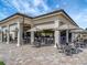 Outdoor bar with seating and patio umbrellas at 17724 Gawthrop Dr # 201, Bradenton, FL 34211