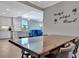Bright dining room with a wood table and four chairs, kitchen and living room views at 17724 Gawthrop Dr # 201, Bradenton, FL 34211