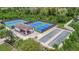 Aerial view of community pickleball courts, bocce ball, and covered pavilion at 17724 Gawthrop Dr # 201, Bradenton, FL 34211