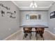 Simple dining room with a wood table and four chairs at 17724 Gawthrop Dr # 201, Bradenton, FL 34211