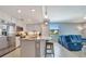Modern kitchen with stainless steel appliances and an island with seating at 17724 Gawthrop Dr # 201, Bradenton, FL 34211