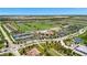 Aerial view of community with golf course, pool, and tennis courts at 17724 Gawthrop Dr # 201, Bradenton, FL 34211