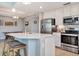 Modern kitchen with stainless steel appliances and a large island at 17724 Gawthrop Dr # 201, Bradenton, FL 34211