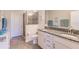 Elegant bathroom with double vanity and a walk-in shower at 8269 Enclave Way # 103, Sarasota, FL 34243