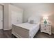 Bright bedroom with double bed, nightstand and built-in closet at 8269 Enclave Way # 103, Sarasota, FL 34243