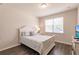 Cozy bedroom with a queen bed and large window at 8269 Enclave Way # 103, Sarasota, FL 34243