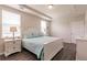 Spacious bedroom with large windows and wood-look floors at 8269 Enclave Way # 103, Sarasota, FL 34243