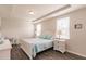 Large bedroom with a comfortable queen bed and white dresser at 8269 Enclave Way # 103, Sarasota, FL 34243