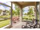 Spacious screened patio overlooking a serene lake at 8269 Enclave Way # 103, Sarasota, FL 34243