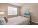 Comfortable bedroom with a queen bed and window at 8269 Enclave Way # 103, Sarasota, FL 34243