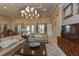 Community lounge with comfortable seating and large TV at 8269 Enclave Way # 103, Sarasota, FL 34243
