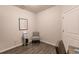 Bright home office with built-in shelving and seating at 8269 Enclave Way # 103, Sarasota, FL 34243