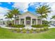 Community clubhouse with landscaping at 8269 Enclave Way # 103, Sarasota, FL 34243