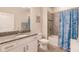 Charming bathroom with tub shower combo and granite countertop at 8269 Enclave Way # 103, Sarasota, FL 34243