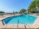 Relaxing community pool with lounge chairs and waterfront views at 24 Tidy Island Blvd # 24, Bradenton, FL 34210