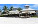 Beachfront restaurant with outdoor seating under umbrellas at 24 Tidy Island Blvd # 24, Bradenton, FL 34210