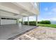 Attached garage with paver driveway and water view at 24 Tidy Island Blvd # 24, Bradenton, FL 34210