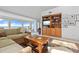 Living room with built-in shelving, comfortable seating, and water views at 24 Tidy Island Blvd # 24, Bradenton, FL 34210