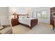Cozy bedroom with a wooden sleigh bed and ample natural light at 24 Tidy Island Blvd # 24, Bradenton, FL 34210