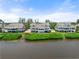 Community overview featuring waterfront homes and landscaping at 24 Tidy Island Blvd # 24, Bradenton, FL 34210