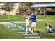 Student receiving golf instruction at driving range at 24 Tidy Island Blvd # 24, Bradenton, FL 34210