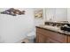 Elegant powder room with granite vanity and updated fixtures at 24 Tidy Island Blvd # 24, Bradenton, FL 34210