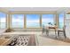 Bright living room features expansive windows offering stunning ocean views and elegant decor at 24 Tidy Island Blvd # 24, Bradenton, FL 34210