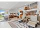 Spacious living room with soaring ceilings, neutral color palette, and open layout to the kitchen at 24 Tidy Island Blvd # 24, Bradenton, FL 34210