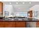 Kitchen with granite countertops, double sink, and water views at 24 Tidy Island Blvd # 24, Bradenton, FL 34210
