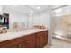 Elegant bathroom with double sinks and a walk-in shower at 24 Tidy Island Blvd # 24, Bradenton, FL 34210