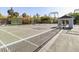 Community tennis courts with net and seating at 24 Tidy Island Blvd # 24, Bradenton, FL 34210